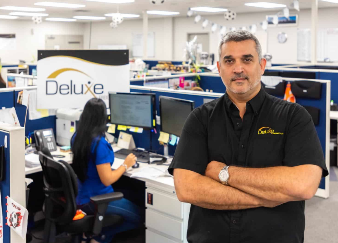 Willie Muñoz, Founder & President of Deluxe Freight, in the Miami office
